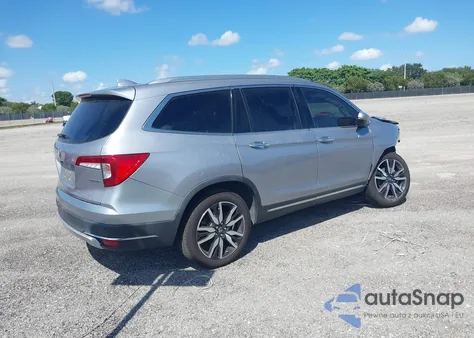 2021 Honda Pilot 2Wd Touring 8 Passenger z USA, uszkodzony, nr VIN 5FNYF5H99MB041638